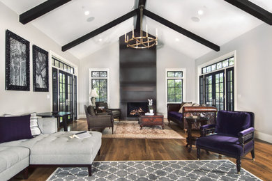 Large classic open plan living room in Denver with grey walls, medium hardwood flooring, a standard fireplace, a metal fireplace surround, no tv and brown floors.