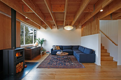 Inspiration for a cottage living room remodel in Seattle with a wood stove