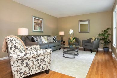 Mid-sized elegant enclosed medium tone wood floor and beige floor living room photo in Philadelphia with beige walls