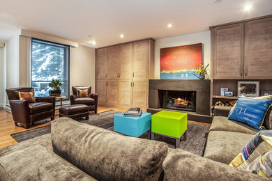 Inspiration for a large contemporary open concept light wood floor living room remodel in Denver with a concrete fireplace, white walls, a standard fireplace and no tv