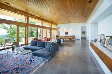 Living room - mid-sized contemporary open concept and formal concrete floor and gray floor living room idea in Nashville with white walls, a standard fireplace, a tile fireplace and a wall-mounted tv