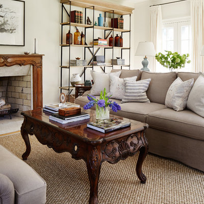 Inspiration for a timeless living room remodel in Chicago with white walls, a standard fireplace and no tv