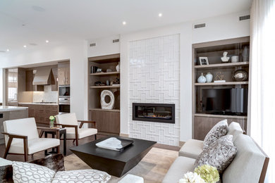Inspiration for a contemporary open concept dark wood floor living room remodel in Calgary with white walls, a ribbon fireplace, a tile fireplace and a tv stand