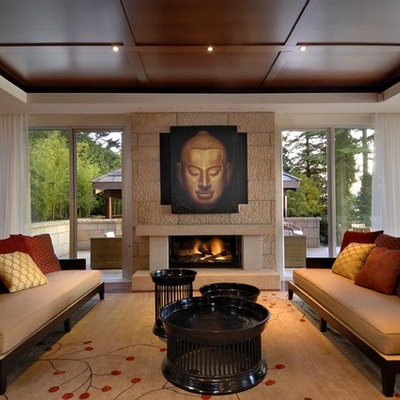 Example of an asian formal and enclosed dark wood floor and brown floor living room design in Calgary with beige walls, a standard fireplace, a stone fireplace and no tv