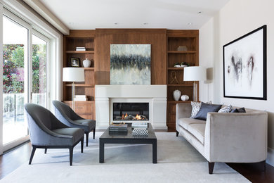 Medium sized traditional formal enclosed living room in Vancouver with beige walls, dark hardwood flooring, a concrete fireplace surround, no tv, a ribbon fireplace and brown floors.
