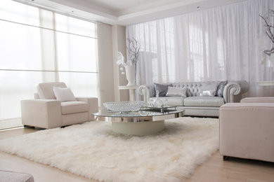 Example of a trendy loft-style light wood floor living room design in Miami with white walls