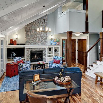 Large mountain style living room photo in Minneapolis with white walls, a standard fireplace and a stone fireplace