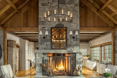 Inspiration for a huge craftsman formal and open concept living room remodel in Boston with a stone fireplace