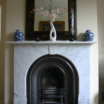 Victorian marble fire surround with arched cast iron grate