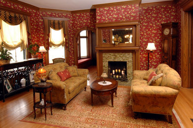 Living room - mid-sized victorian formal and enclosed light wood floor living room idea in New York with a standard fireplace, a tile fireplace and no tv