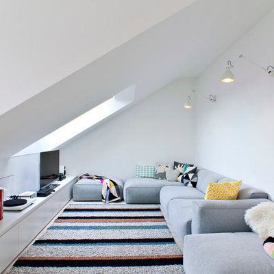 Living room - scandinavian formal and enclosed living room idea in Other with white walls and a tv stand