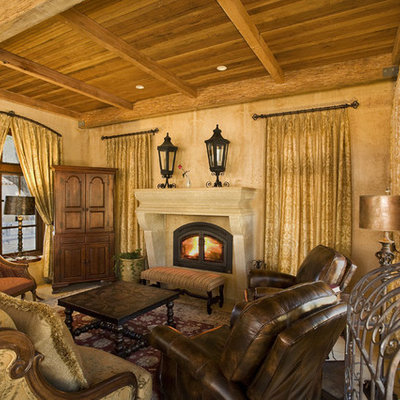 Inspiration for a mediterranean enclosed living room remodel in San Francisco with beige walls, a standard fireplace and no tv