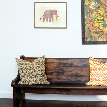 Vintage Deacon's Bench (Church Pew) with Ikat Pillows and Oil Paintings