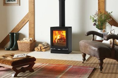 Design ideas for a contemporary living room in Devon with a wood burning stove.