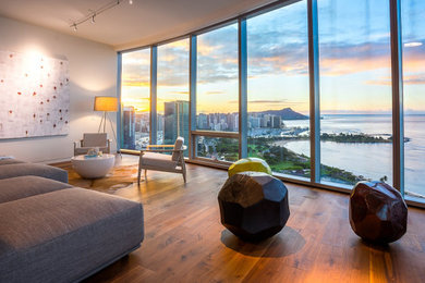 Inspiration for a modern open concept laminate floor and brown floor living room remodel in Hawaii