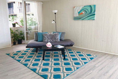 Living room - coastal laminate floor and gray floor living room idea in Hawaii