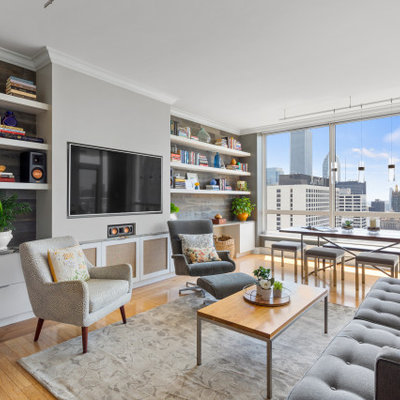 Trendy living room photo in Chicago with a media wall
