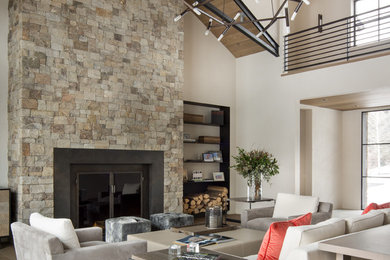 Living room - contemporary formal and open concept living room idea in Boise with beige walls and a standard fireplace