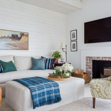 Warm Transitional Coastal Living Room with Brick Fireplace