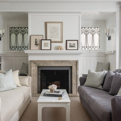 Example of a transitional enclosed living room design in San Francisco with white walls and a standard fireplace