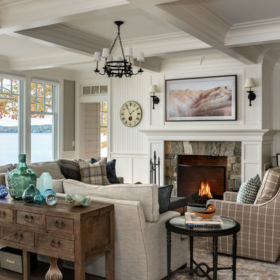Inspiration for a coastal formal light wood floor living room remodel in Boston with white walls, a standard fireplace, a stone fireplace and no tv