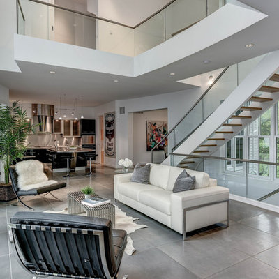 Living room - large contemporary open concept and formal concrete floor and gray floor living room idea in DC Metro with white walls, a standard fireplace, a tile fireplace and no tv