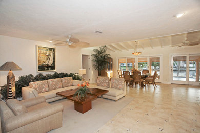 Example of a huge beach style open concept living room design in Miami