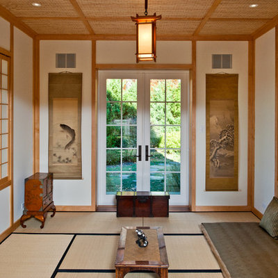 Example of a large asian enclosed bamboo floor living room design in New York with white walls, no fireplace and no tv