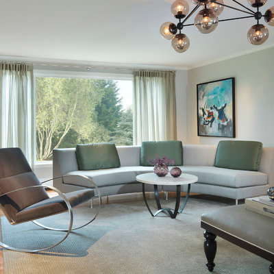 Example of a large transitional enclosed light wood floor living room design in Boston with green walls, no fireplace and no tv