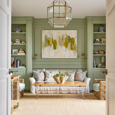 Example of a transitional formal and enclosed medium tone wood floor living room design in Dallas with green walls and no tv