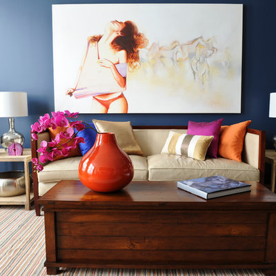 Living room - eclectic living room idea in Vancouver with blue walls