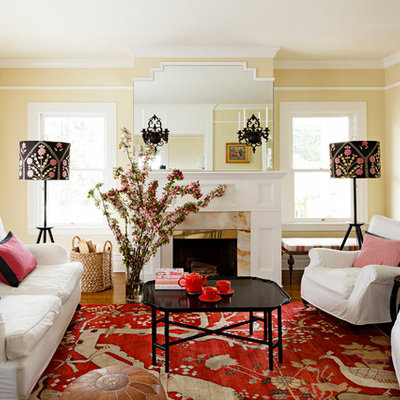 Inspiration for a timeless living room remodel in Portland with beige walls and a standard fireplace