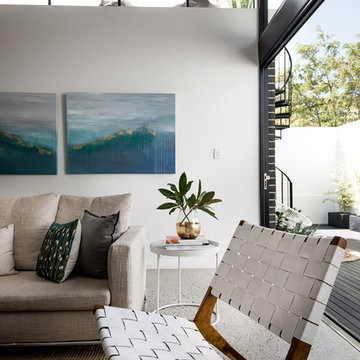 West Leederville Residence - Living room with large bifold doors opening up to t