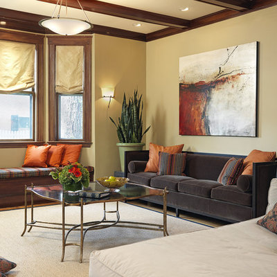 Large elegant formal and enclosed medium tone wood floor living room photo in Boston with beige walls, a standard fireplace, a brick fireplace and a tv stand