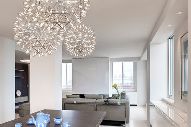Diseño de salón abierto contemporáneo de tamaño medio con paredes blancas, suelo de cemento y suelo beige