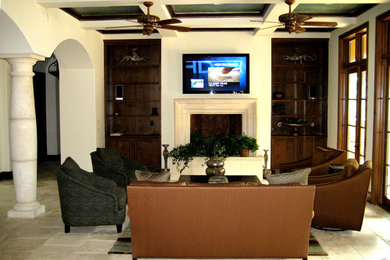 Foto de salón cerrado tradicional de tamaño medio con paredes beige, suelo de mármol, todas las chimeneas, marco de chimenea de piedra y televisor colgado en la pared