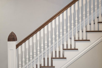 Example of a mid-sized transitional staircase design in St Louis