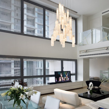 White candles chandelier - by Galilee Lighting - Two story living room chandelie