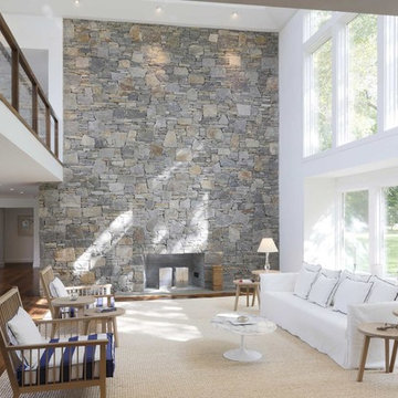 White Centre Island Living Room with Field Stone Fireplace