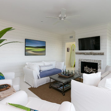 White Living Room with Oyster Fireplace, Driftwood Mantle, Wood Ship Walls