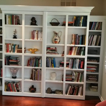 White Murphy Bed with pivoting Library bookcases