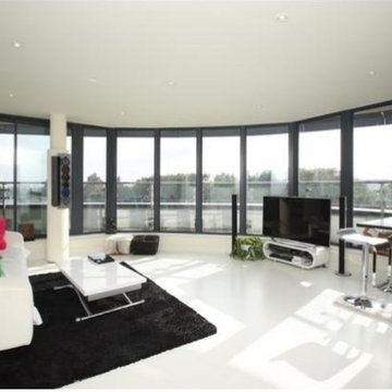 WHITE POURED RUBBER BAREFOOT COMFORT FLOORING FOR DOCKLANDS PENTHOUSE