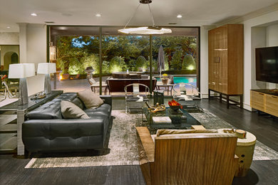 Living room - contemporary dark wood floor and black floor living room idea in Dallas with gray walls
