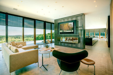 Example of a large minimalist open concept concrete floor and gray floor living room design in DC Metro with a ribbon fireplace, a metal fireplace and a wall-mounted tv