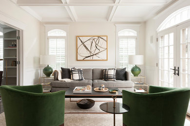 Example of a transitional enclosed medium tone wood floor and brown floor living room design in Chicago with beige walls