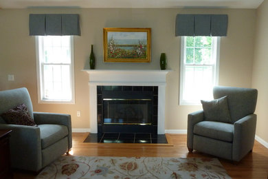 Example of a mid-sized classic formal and enclosed medium tone wood floor living room design in Providence with beige walls, a standard fireplace, a tile fireplace and no tv