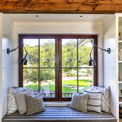 Living room - large coastal open concept and formal medium tone wood floor living room idea in Boston with white walls