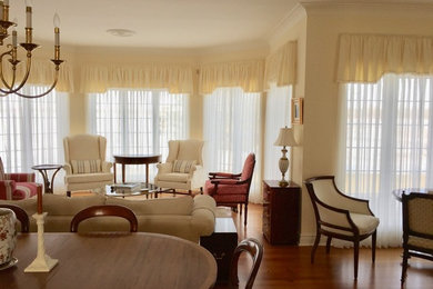 Living room - contemporary brown floor living room idea in Toronto with beige walls