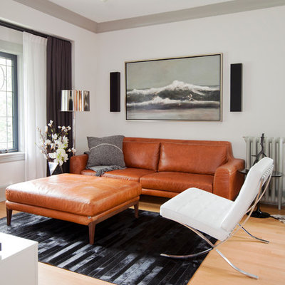 Living room - scandinavian open concept light wood floor living room idea in Vancouver with white walls