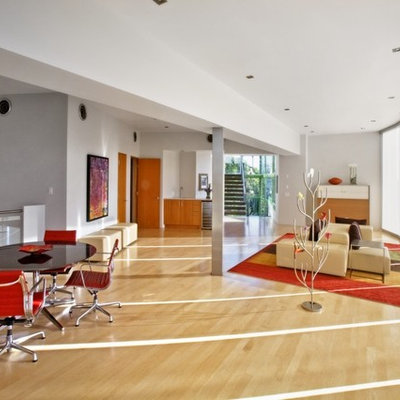 Living room - huge contemporary formal and open concept light wood floor and beige floor living room idea in Austin with white walls and no fireplace
